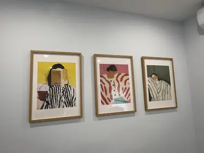 four framed pictures hanging on a wall at Apartamento Centro de Rota La Costilla in Rota