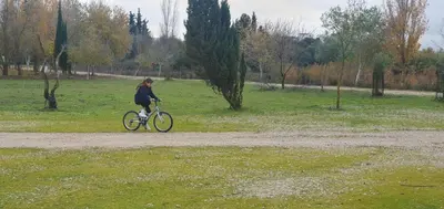 a person riding a bike on a path in a field at Vivienda Rural El Piketa in Algar