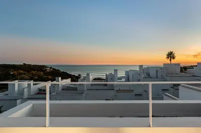 a view of the ocean from the roof of a building at Casa junto al mar con piscina 45 in Conil de la Frontera