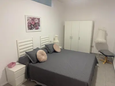 a bedroom with a bed with two pillows on it at Austria 03 in Lebrija