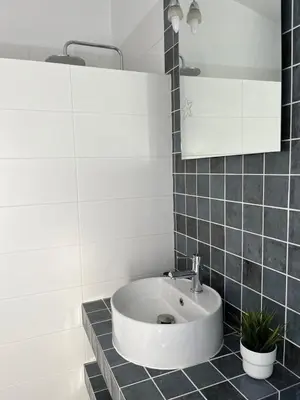 a bathroom with a sink and a mirror at Los Granainos in El Guijo