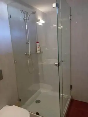 a shower with a glass door in a bathroom at Villa Playa La Barrosa in Novo Sancti Petri