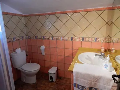 a bathroom with a toilet and a sink at Casas Elena-Conil in Conil de la Frontera