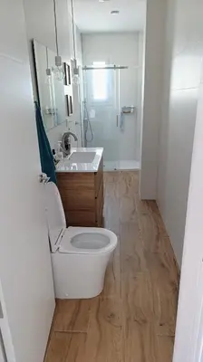 a bathroom with a toilet and a sink and a shower at Ático recién reformado en el centro de Sanlúcar - LOVE SANLUCAR in Sanlúcar de Barrameda