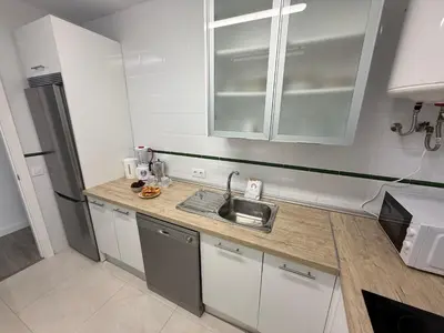 a kitchen with a sink and a counter top at GATU Prioral in El Puerto de Santa María