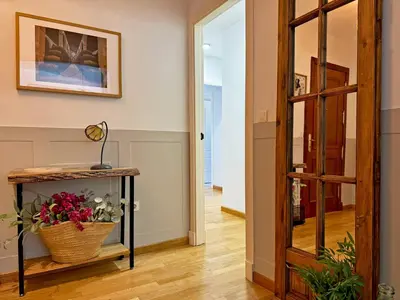 a bathroom with a shower and a washing machine at Apartamento Antique Muralla - Ole Solutions in Jerez de la Frontera