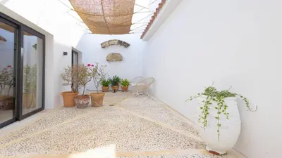 a room with potted plants on the floor at Casa Chica 1 Sanlúcar de Barrameda. by Ruralidays in Sanlúcar de Barrameda