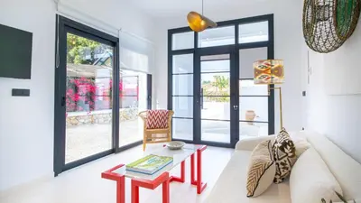 a living room with a couch and a table at Casa Chica 1 Sanlúcar de Barrameda. by Ruralidays in Sanlúcar de Barrameda