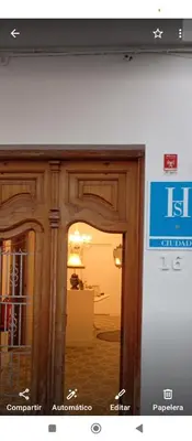 a view of a room through a glass door at Hs Nieves Centro in Chipiona