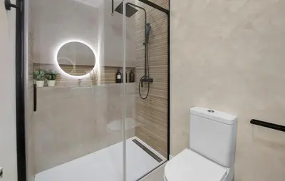 a bathroom with a shower with a toilet and a mirror at 1 Bedroom Nice Apartment In Arcos De La Frontera in Arcos de la Frontera