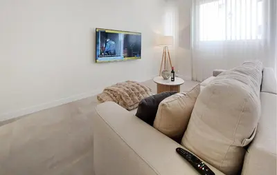 a living room with a couch and a tv at 1 Bedroom Nice Apartment In Arcos De La Frontera in Arcos de la Frontera