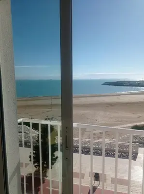 a view of the beach from a balcony at Balcón al Mar in Rota