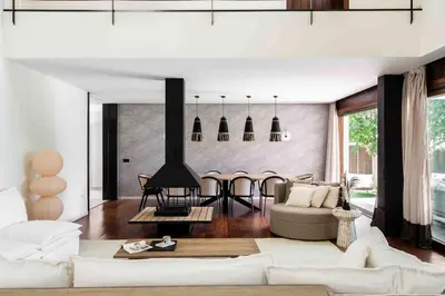 a living room with a couch and a fireplace at A paradise with ocean views in Conil de la Frontera