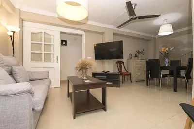 a living room with a couch and a table at Victoriamar in Cádiz