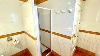 a shower with a glass door in a bathroom at Avenida de los Pescadores in Novo Sancti Petri