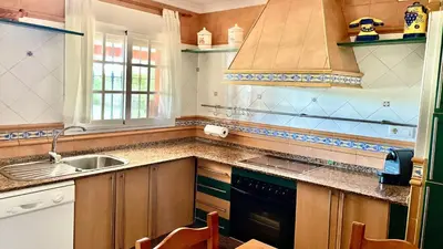 a kitchen with a sink and a stove at Avenida de los Pescadores in Novo Sancti Petri