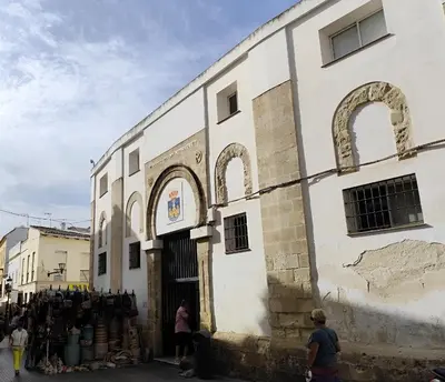 a building with arches on the side of it at Adelitas Home El Puerto in El Puerto de Santa María
