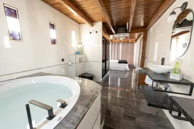 a living room with a table and a couch at Atico Con Encanto Centro in Jerez de la Frontera