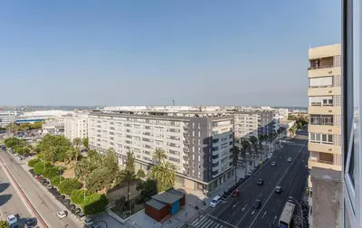 an aerial view of a city with buildings and a street at Ático Avda Cádiz Playa in Cádiz