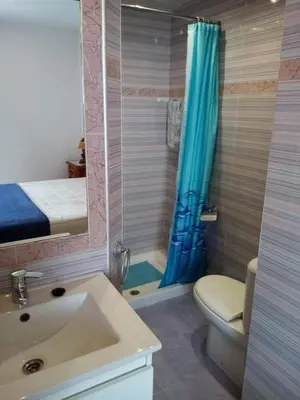 a bathroom with a sink and a toilet and a shower at La Barrosa beach Chiclana in Novo Sancti Petri