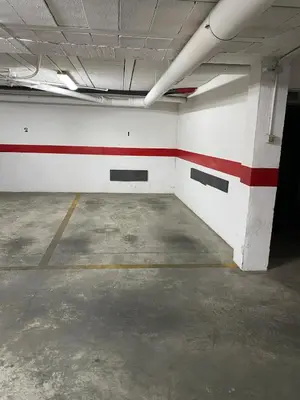 an empty room with a red and white wall at Dúplex Casco Histórico, terraza, garaje in Sanlúcar de Barrameda