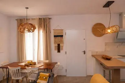 a kitchen and dining room with a table and chairs at Chalet con piscina en Naveros in Los Naveros