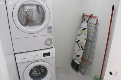 a washing machine and a washer in a bathroom at Chalet con piscina en Naveros in Los Naveros