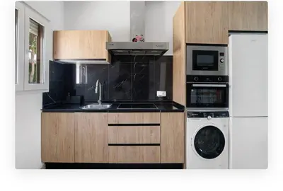 a kitchen with a sink and a washing machine at Casa Dana in Cádiz