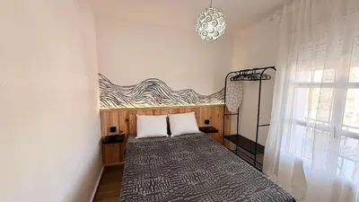 a bedroom with a bed in a room at Apartamentos ÁBREME Y VERÁS in Arcos de la Frontera