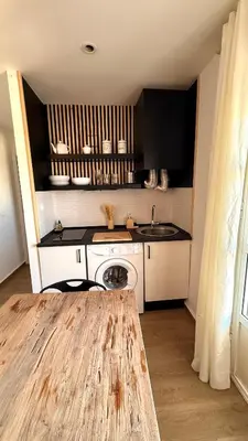 a small kitchen with a sink and a counter at Apartamentos ÁBREME Y VERÁS in Arcos de la Frontera