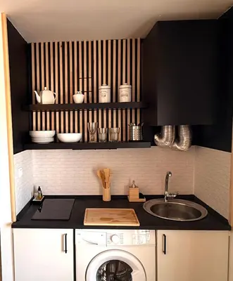 a kitchen with a washing machine and a sink at Apartamentos ÁBREME Y VERÁS in Arcos de la Frontera