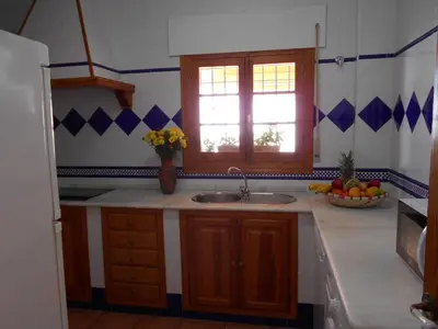 a kitchen with a sink and a bowl of fruit at Holiday Home Touristenwohnung Apartment mit Terrasse by Interhome in Chipiona
