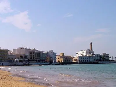 a view of a beach with buildings and the ocean at Holiday Home Touristenwohnung Apartment mit Terrasse by Interhome in Chipiona