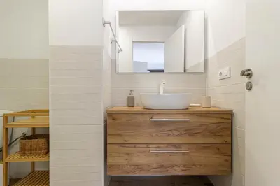 a bathroom with a sink and a mirror at Allo Apartments Catedral Centro 3 Habitaciones in Jerez de la Frontera