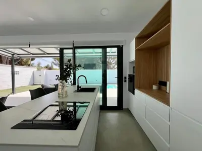 a kitchen with a sink and a counter top at Casa Lumier in Chiclana de la Frontera