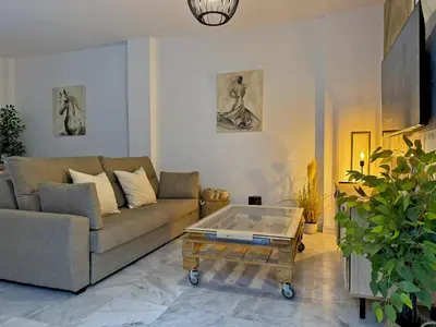 a living room with a couch and a coffee table at Apartamento Castellanos - Ole Solutions in Jerez de la Frontera