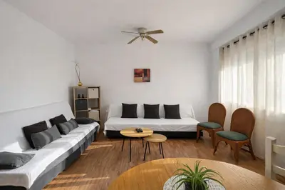 a bedroom with a blue bed and a window at BARLOVENTO Family Home by Cadiz4Rentals in Cádiz