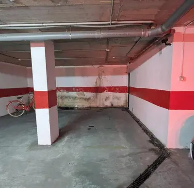 an empty room with red and white stripes on the wall at Molly's Sunny Penthouse in Sanlúcar de Barrameda