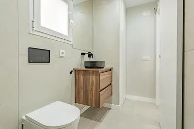 a bathroom with a toilet and a sink at Loft El Estudio in Arcos de la Frontera