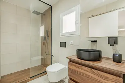 a bathroom with a sink and a toilet and a shower at Loft El Estudio in Arcos de la Frontera