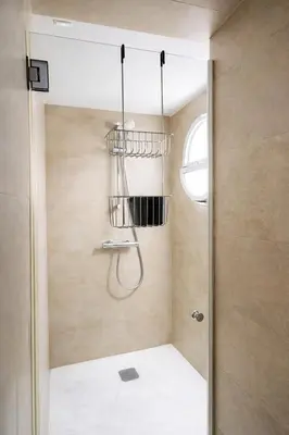 a bathroom with a shower with a glass door at Rosario by Gades Gestión in Cádiz