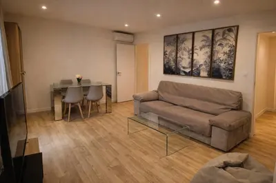 a living room with a couch and a table at Rosario by Gades Gestión in Cádiz
