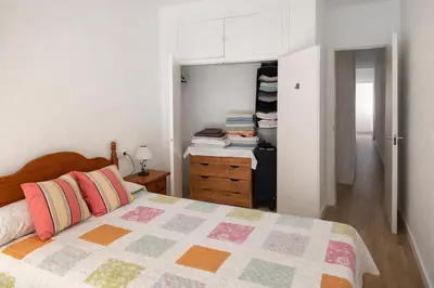 a bedroom with a bed and a closet at SOTAVENTO Apartment by Cadiz4Rentals in Cádiz