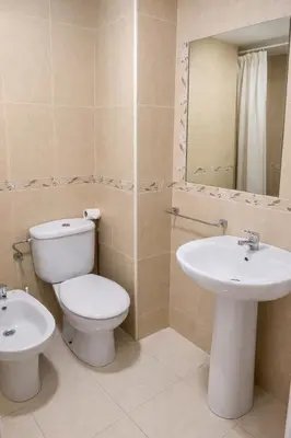 a bathroom with a toilet and a sink at SOTAVENTO Apartment by Cadiz4Rentals in Cádiz