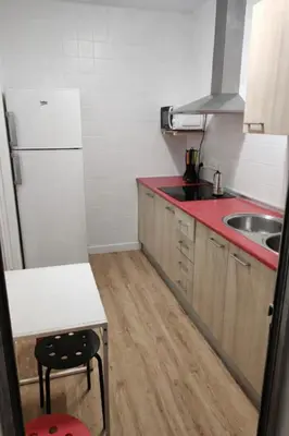 a small kitchen with a sink and a refrigerator at SOTAVENTO Apartment by Cadiz4Rentals in Cádiz