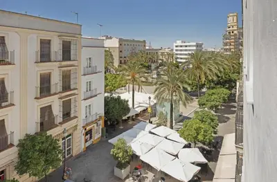 an overhead view of a city with palm trees and buildings at Casa MILANO JEREZ 1 in Jerez de la Frontera