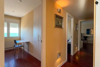 a living room with a table and a dining room at Pacifico Grupo AC Gestion in Cádiz