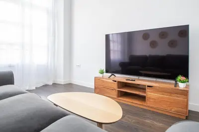 a living room with a large flat screen tv at Zambra en Cádiz in Cádiz