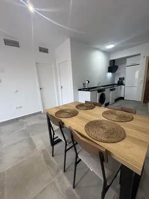 a kitchen with a sink and a dishwasher at Reserva de Confianza Bahía Sur in San Fernando