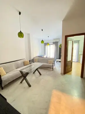 a living room with a couch and a table at Piso en el Centro de Sanlucar in Sanlúcar de Barrameda